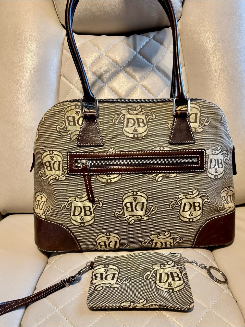 Dooney & Bourke Beige Canvas Satchel with Brown Trim and Logo Print